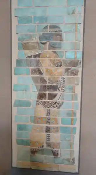 Archer with eight-point solar disc design on his clothes